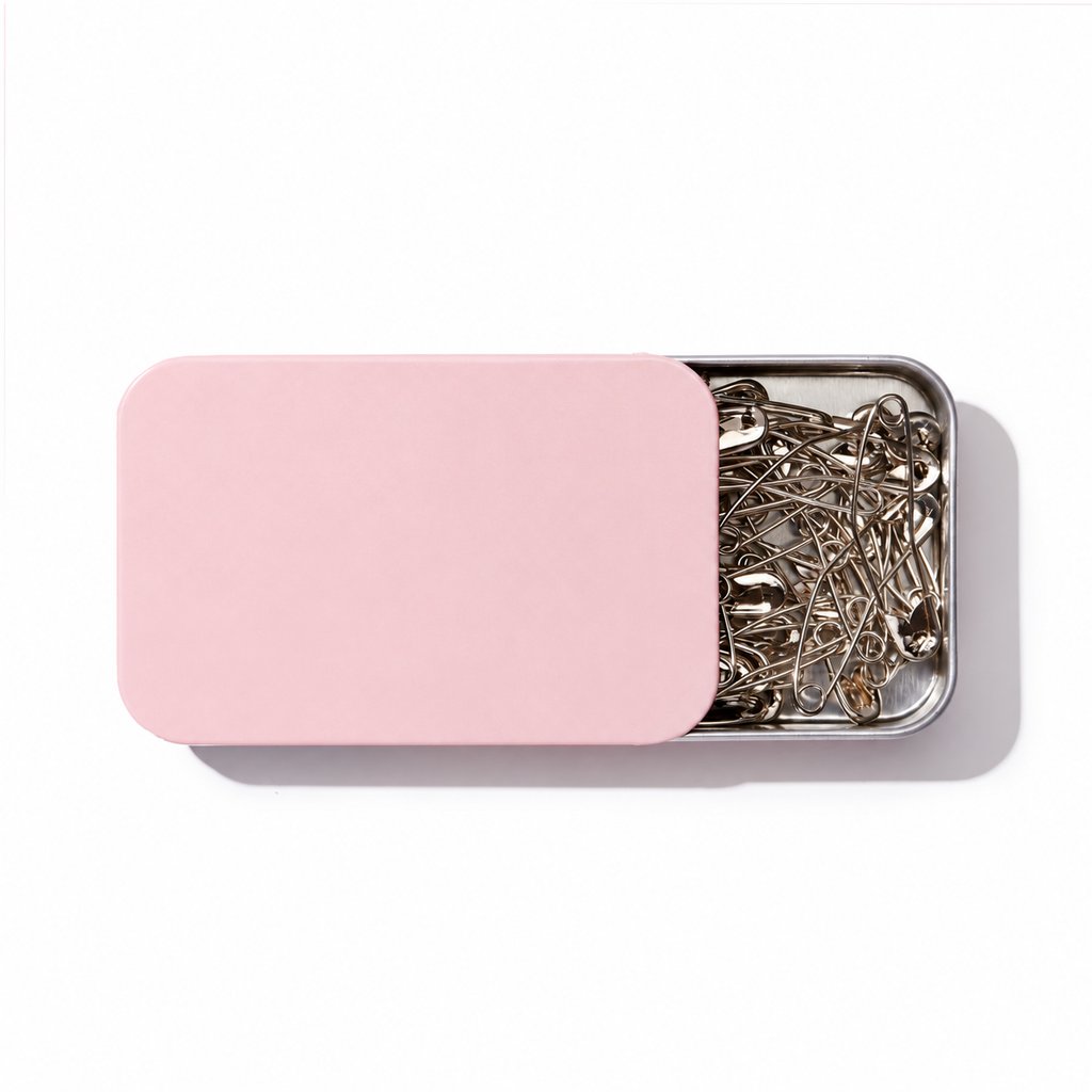 Curved basting pins in a storage tin, alternate view 4