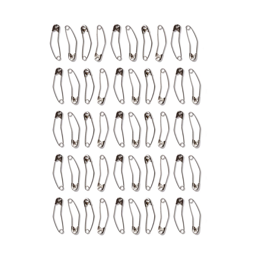 Curved basting pins in a storage tin, alternate view 5